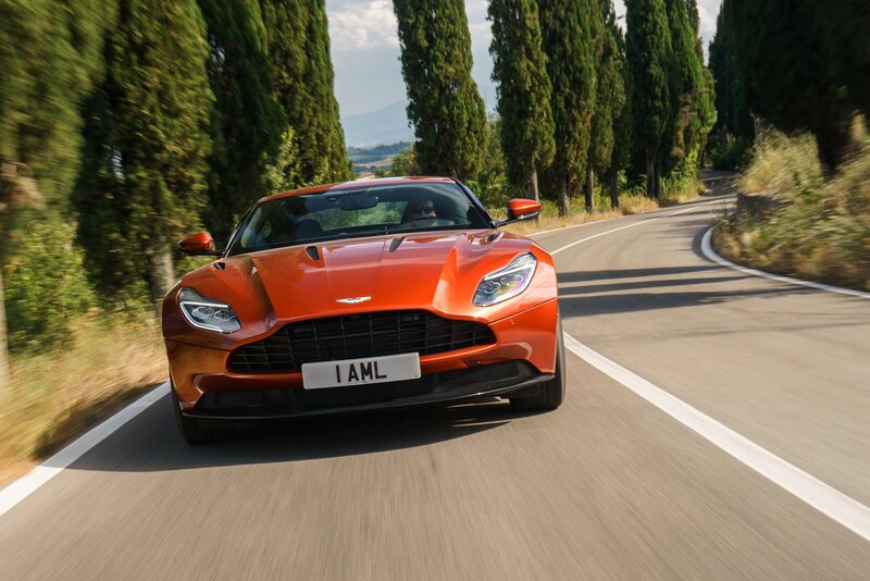 Orange sports car on a winding road