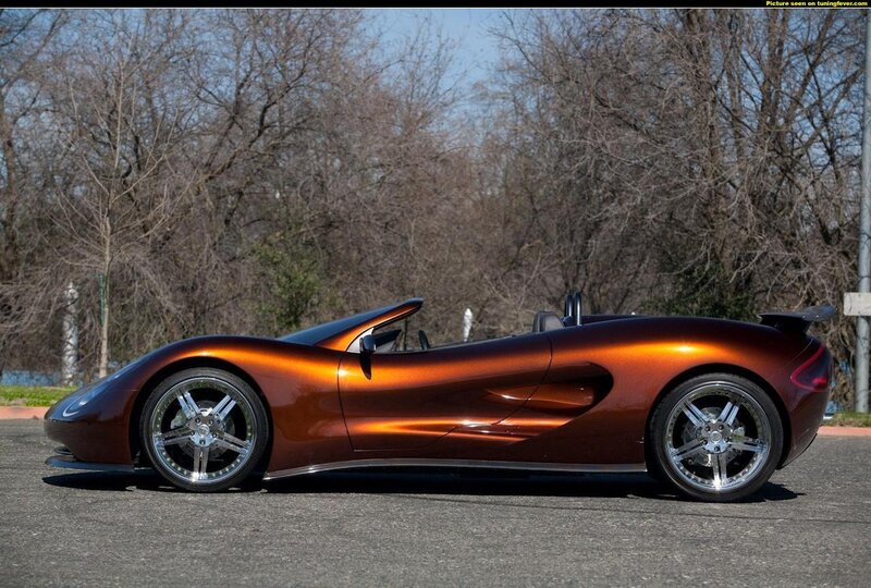 orange sports car on asphalt