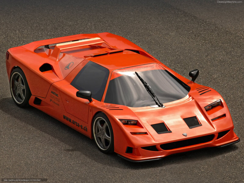 orange sports car on asphalt