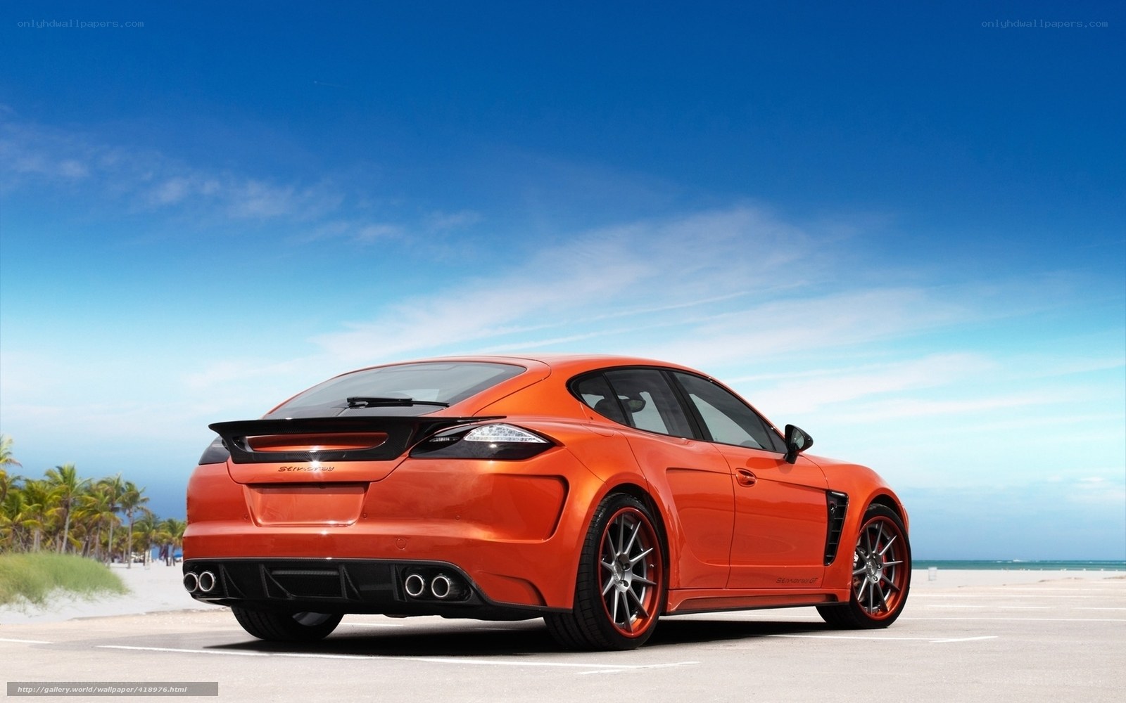 Orange sports car on beach