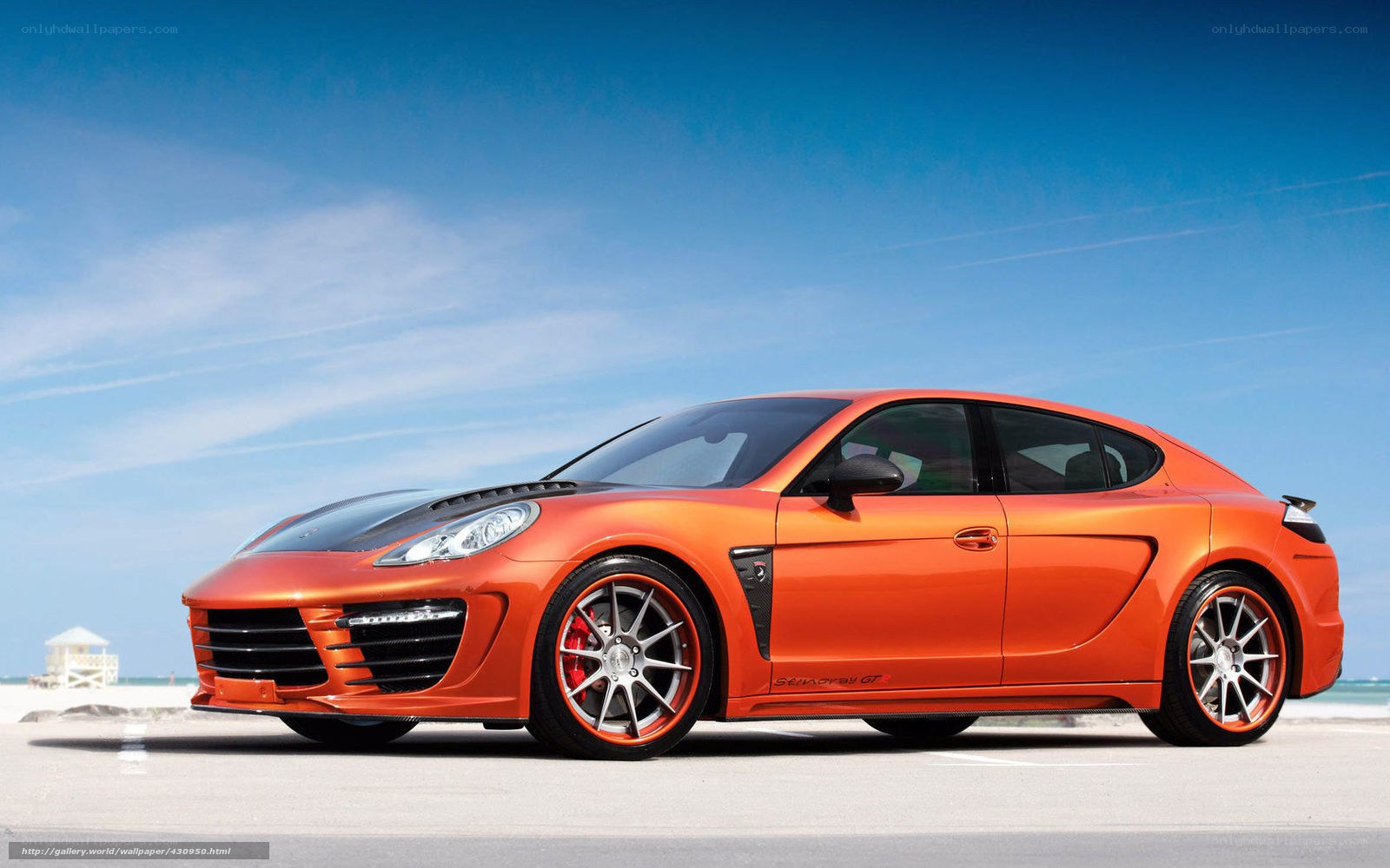 Orange sports car on beach