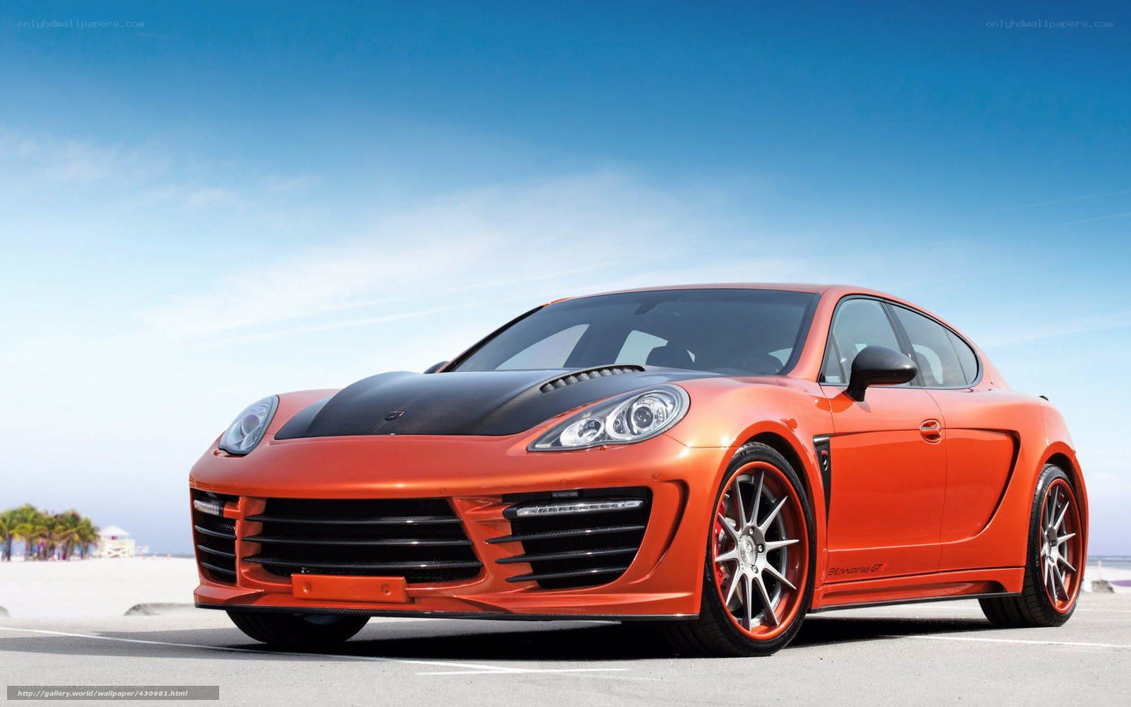 Orange sports car on beach