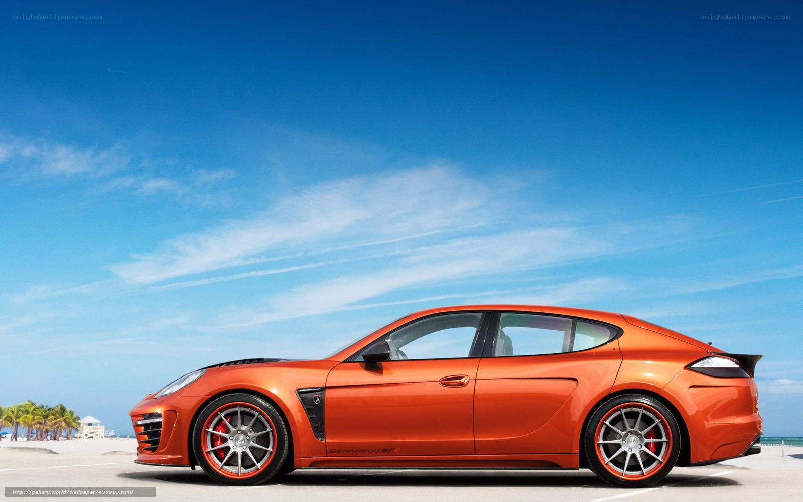 Orange sports car on beach