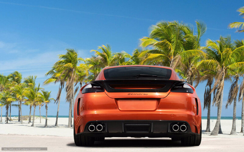 Orange sports car on beach