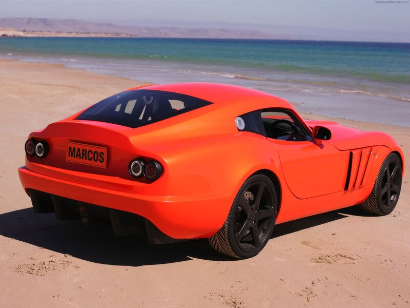 Orange sports car on beach