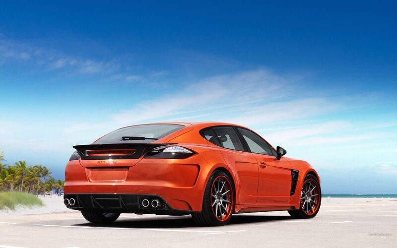 Orange sports car on beach