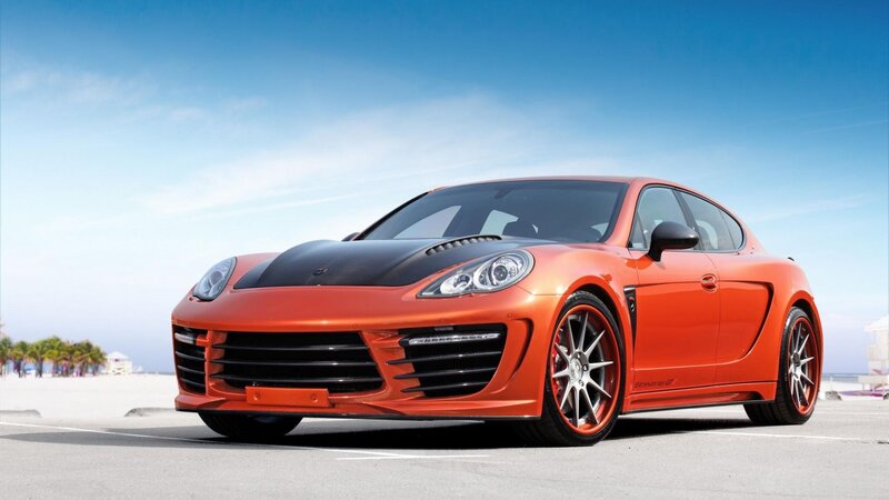 orange sports car on beach