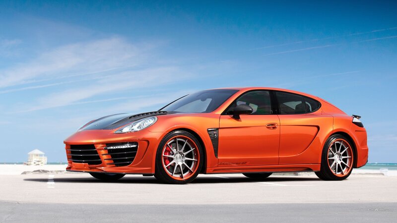 Orange sports car on beach