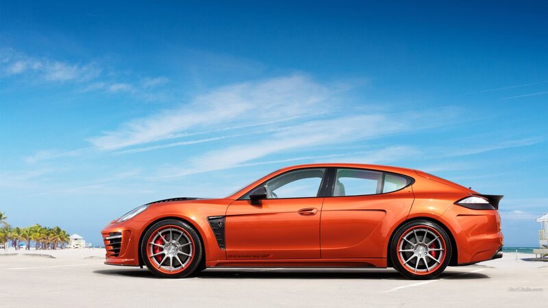 orange sports car on beach
