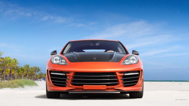 Orange sports car on beach