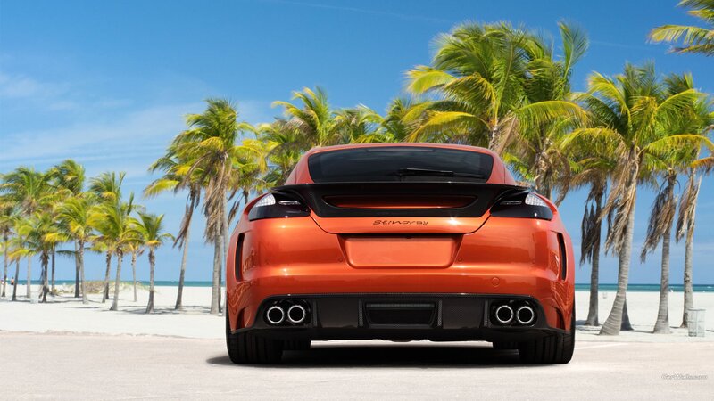 Orange sports car on beach