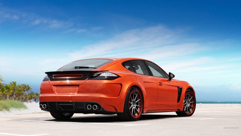 Orange sports car on beach