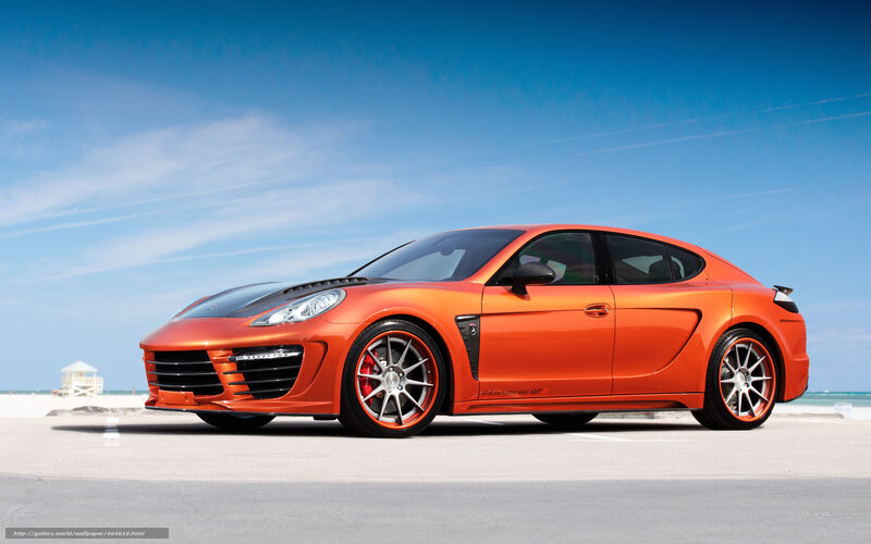 orange sports car on beach