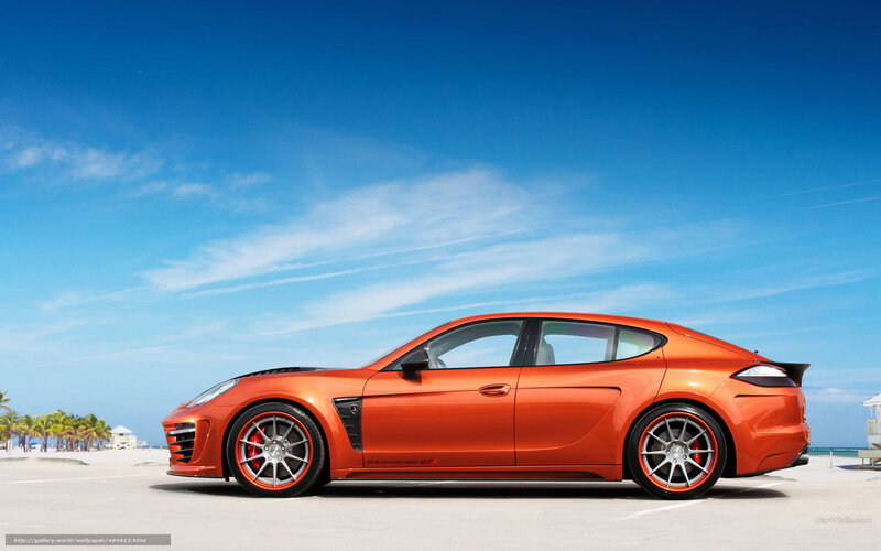 orange sports car on beach