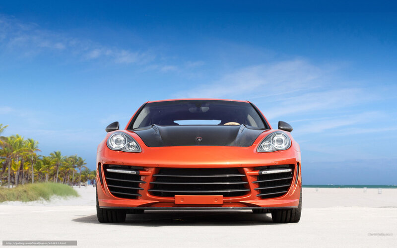 Orange sports car on beach
