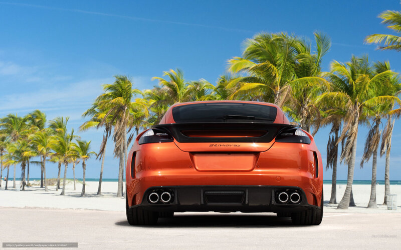 Orange sports car on beach