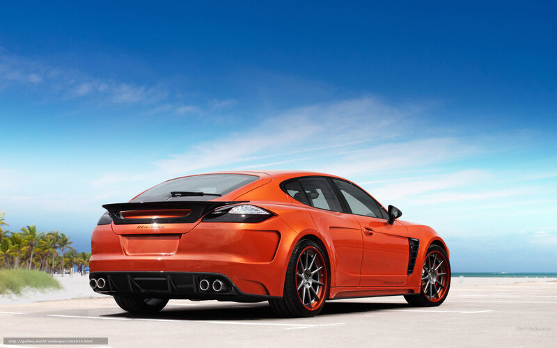 Orange sports car on beach