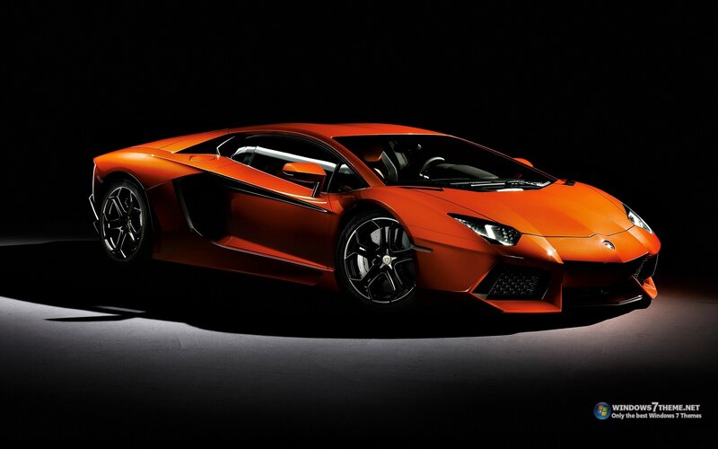 orange sports car on black
