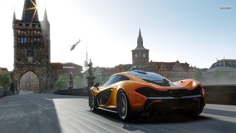 orange sports car on bridge