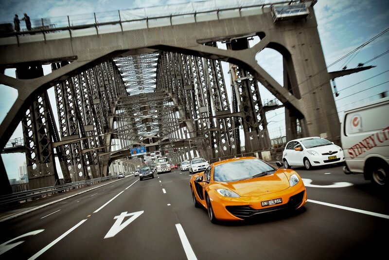 Orange sports car on bridge