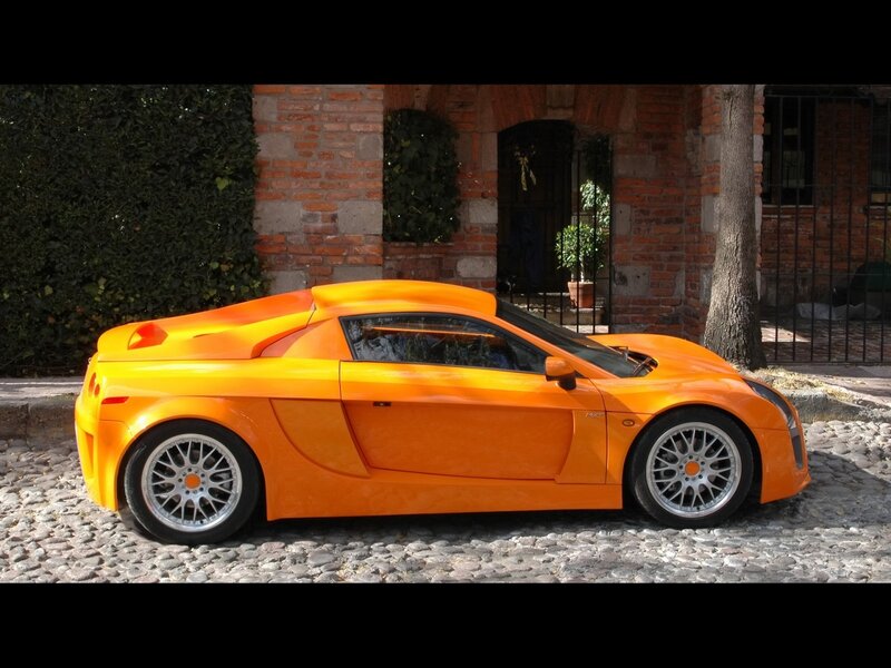 Orange sports car on cobblestone