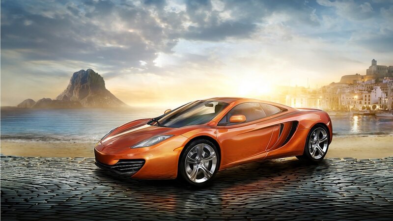 Orange sports car on cobblestone