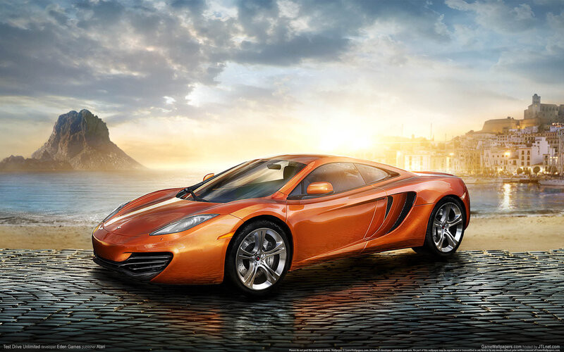 Orange sports car on cobblestone