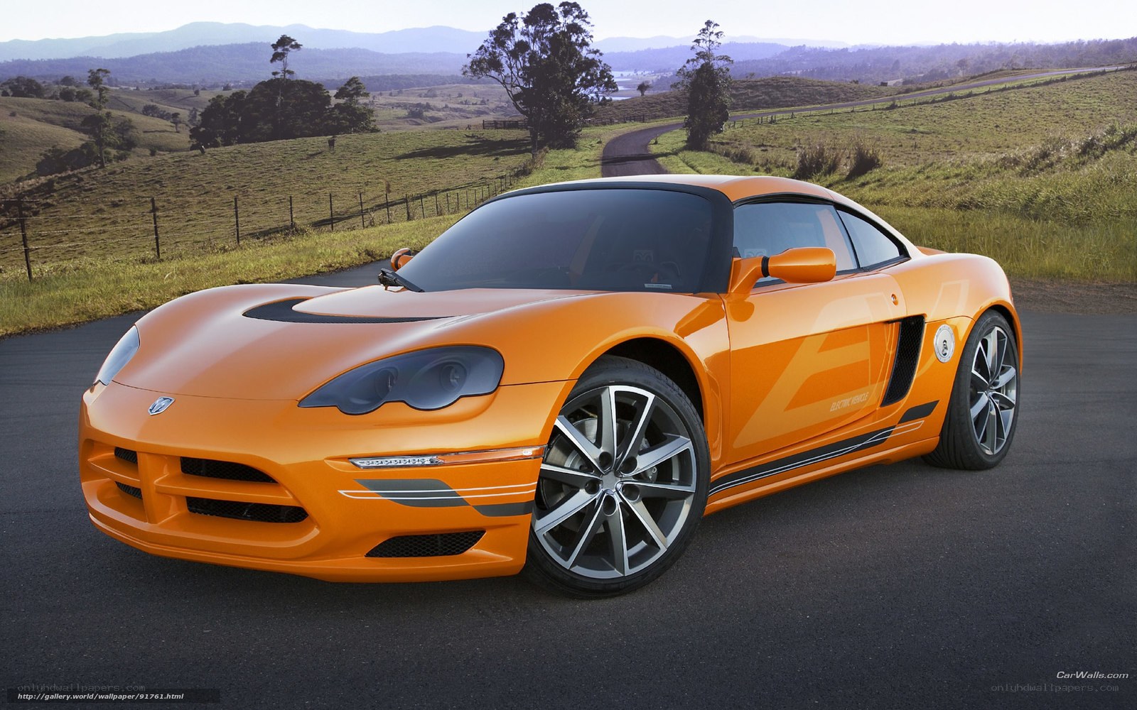Orange sports car on country road
