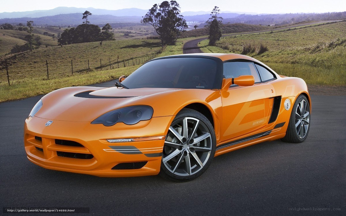 orange sports car on country road