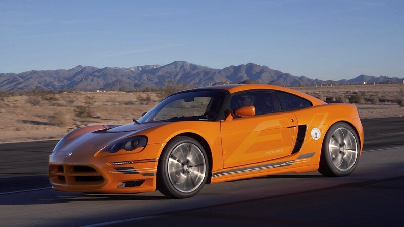 Orange sports car on desert road