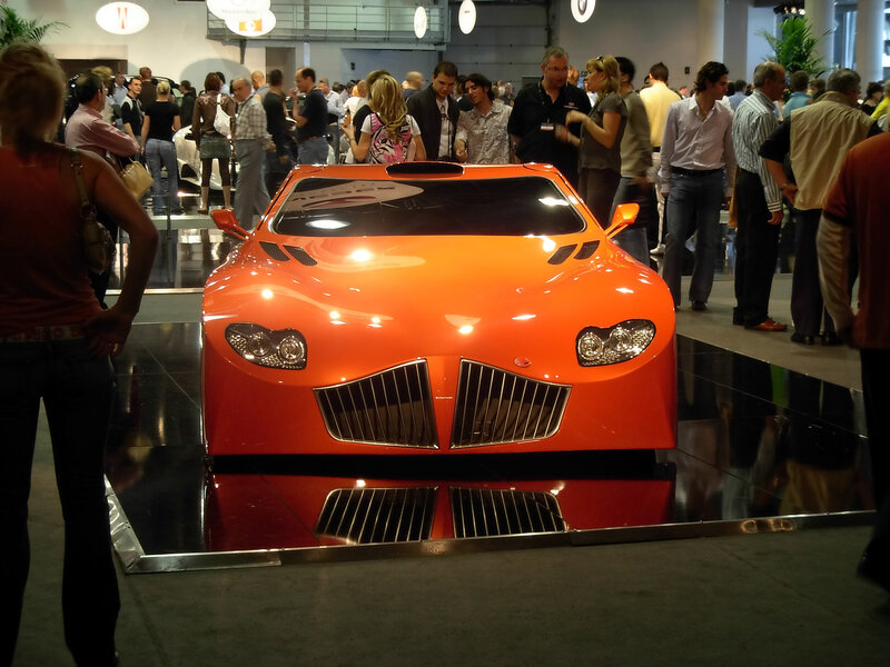 Orange sports car on display
