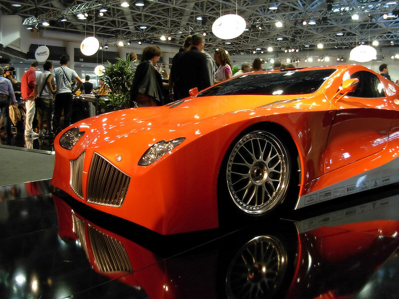 Orange sports car on display