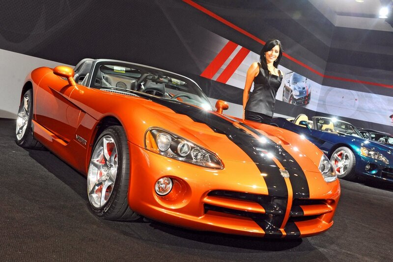 Orange sports car on display