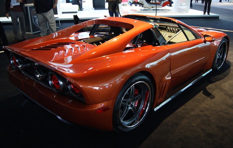 orange sports car on display