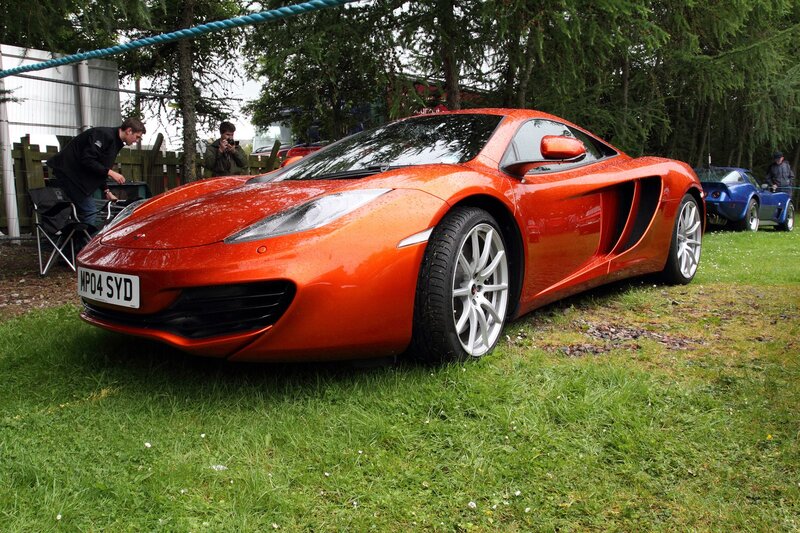 Orange sports car on display