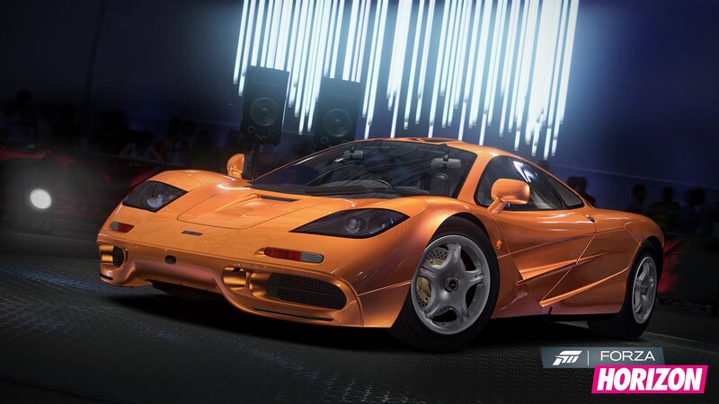 Orange sports car on display