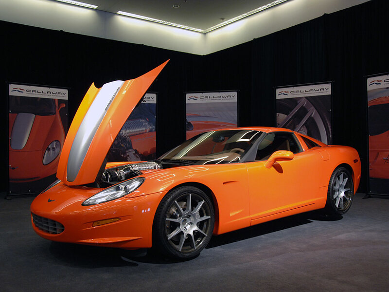 Orange sports car on display
