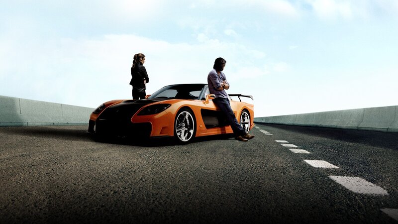 orange sports car on highway