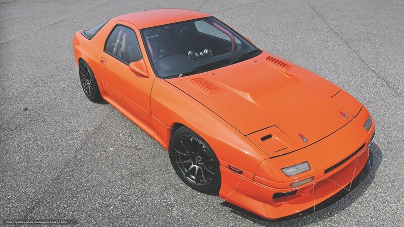 orange sports car on pavement