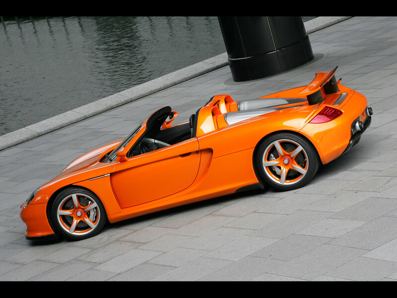 Orange sports car on pavement