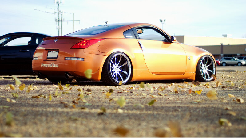 orange sports car on pavement