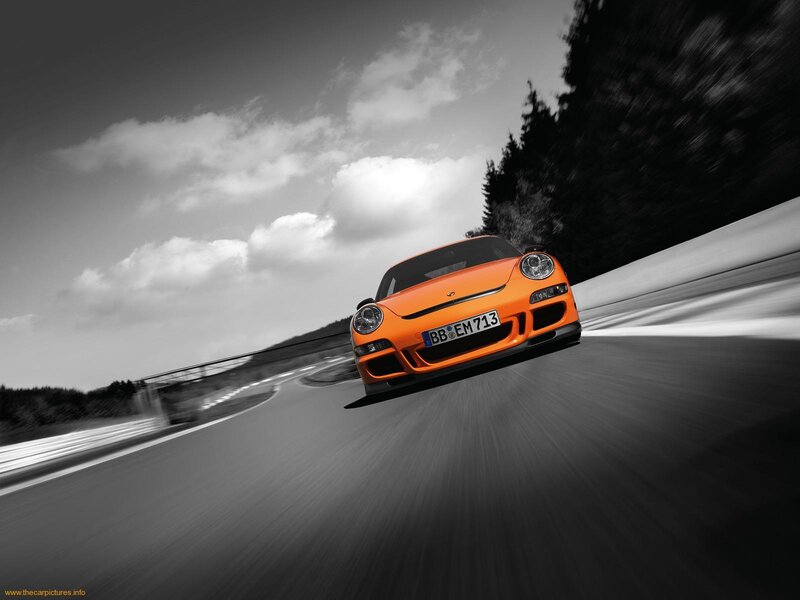 orange sports car on racetrack