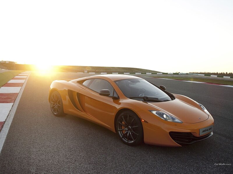 orange sports car on racetrack