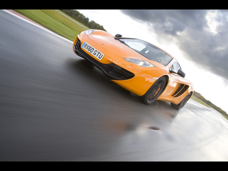 orange sports car on racetrack