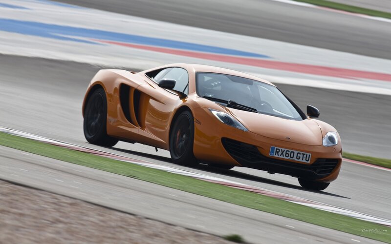 orange sports car on racetrack