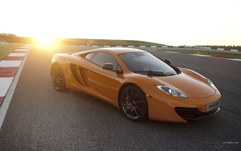 orange sports car on racetrack