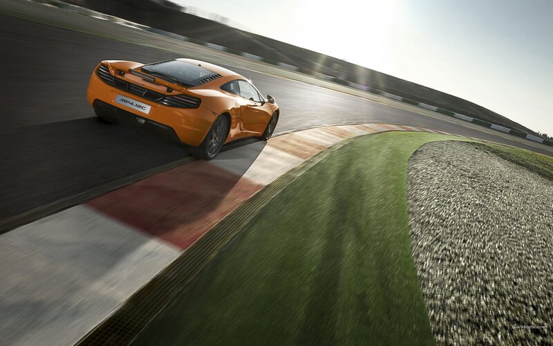 Orange sports car on racetrack