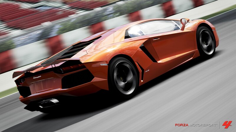 orange sports car on racetrack