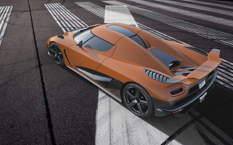 orange sports car on racetrack