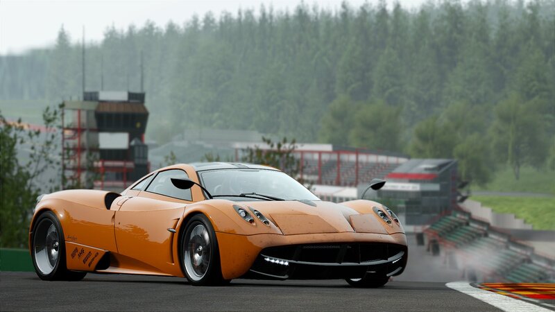 orange sports car on racetrack